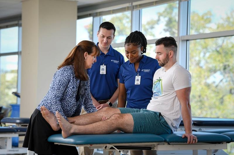 Physical therapist consultation with a patient